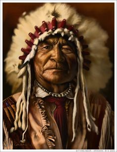 an old native american man wearing a headdress