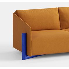 an orange and blue couch sitting on top of a white floor