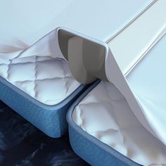 two mattresses sitting next to each other on the floor