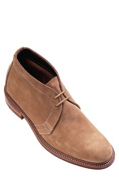 This unlined chukka boot made from soft suede has been hand stained to a classic patina, a hallmark of Alden of New England. Unsurpassed for breathable comfort and long wear, this footwear adapts to the contours of your foot shape over time, giving a truly custom quality fit. Beneath the insole is a layer of natural cork, providing additional resilience and insulation. Style Name:Alden Chukka Boot (Men). Style Number: 5446585. Available in stores. Classic Suede Chukka Boots With Suede Lining, Rugged Suede Boots With Goodyear Welting, Classic Chukka Boots With Suede Lining For Work, Classic Suede Desert Boots With Leather Lining, Classic Suede Chukka Boots With Goodyear Welt Construction, Classic Suede Chukka Boots With Rubber Sole, Suede Chukka Boots With Plain Toe, Classic Suede Moc Toe Boots, Brown Goodyear Welted Moc Toe Desert Boots