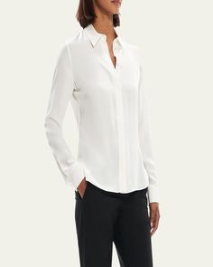 Theory silk shirt with back vertical darts    Spread collar; hidden button front    Long sleeves; button cuffs    Back yoke    Rounded hem    Classic fit    Silk    Item runs small, consider ordering a size up    Imported Elegant Silk Tops With Concealed Placket, Elegant Silk Shirt With Concealed Placket, Elegant Silk Shirt For Workwear, Elegant Silk Shirt For Work, Elegant Silk Top For Business, Chic Silk Business Blouse, Elegant Semi-formal Blouse With Hidden Button Closure, Timeless Business Casual Blouse With Button Closure, Chic Silk Blouse For Business