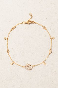 Gucci takes every opportunity to celebrate its illustrious history. This dainty bracelet is crafted from 18-karat rose gold and threaded with namesake 'Interlocking G' links, including a larger one frosted with pavé diamonds. We have the matching necklace in our edit, too. Luxury Charm Bracelet With Logo, Luxury Gold Jewelry With Logo Charm, Gucci Yellow Gold Bracelet For Formal Occasions, Gucci Elegant Yellow Gold Bracelet, Luxury 14k Gold Diamond Bracelet With Adjustable Chain, Gold Diamond Bracelet With Adjustable Chain, Luxury 14k Gold Diamond Bracelet With Delicate Chain, Luxury Rose Gold Plated Charm Bracelet, Luxury Rose Gold Gold-plated Charm Bracelet