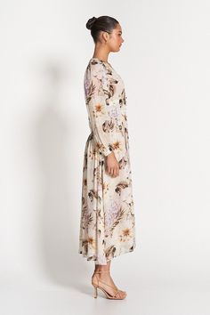 Cut in our label-exclusive Flora Print, the whimsical Capri Sheer Midi Dress is designed to elegantly shape and flatter. Comfortable and versatile, the dress is composed of a sheer georgette with features including a v-neckline, blouson sleeves, tailored torso and sculpted waistband. Model is 176cm and wears a size 8.Fits true to size. - 100% Viscose- 100% Polyester Lining- Elasticated Cuffs- Functional Self-covered Buttons- Fully Lined (ex. Sleeves) Airy Flowy V-neck Dress, Elegant Floral Maxi Dress For Daywear, Feminine Chiffon Midi Dress For Daywear, Feminine Daywear Maxi Dress In Viscose, Flowy Midi Floral Dress For Daywear, Elegant Daywear Chiffon Maxi Dress, Elegant Maxi Length Chiffon Dress For Daywear, Chiffon Long Dress For Brunch, Elegant Flowy Floral Dress For Daywear