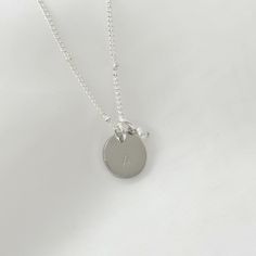 Express your unique personality with this Sterling Silver plated initial necklace that is both stylish and sentimental. The personalized initial charm sits elegantly between the collar bones, adding a polished touch to any outfit. To make this necklace even more special, it can be customised with a letter, heart or star sign of your choice. This adds a unique touch to the piece, making it a perfect gift for yourself or someone special. ♡ Handcrafted and Stamped in our Sydney Studio ♡  Natural Fr Letter Necklace Initials, Suede Jewelry, Personalised Necklace, Minimalist Gifts, White Jewelry, Pearl Charms, Star Sign, Letter Necklace, Initial Charm