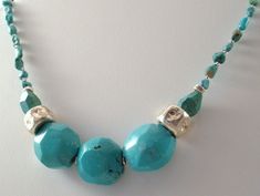 "So large and fab are these Turquoise stones...not too blue or too green, just the perfect turquoise color.  I added 2 large Fine Silver (99.9 silver) hammered beads on either side of the large center turquoise beads (approx 1\" each).  Stunning with a white tee, a white button down shirt or even a little black dress...it's the perfect pop of color.  Turquoise is huge every year!  15 3/4\" plus a 2\" sterling silver extender chain and lobster claw clasp." Chunky Jewellery, Green Tassel Earrings, Diy Necklaces, Turquoise Statement Necklace, Beaded Jewelry Necklaces, Large Beads, Big Jewelry, Portland Me, Turquoise Bead Necklaces