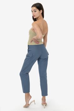 The Adjustable Waist Field Slack was designed to be comfortable and utilitarian, yet flattering and feminine. With 3 adjustable waist buttons at the hip, this is a pant that you can alter depending on how you prefer to style it. Wear it high and tight on the smallest waist button or adjust if you want to tuck a thick sweater in- or if you've had one too many burritos! Darts on the front and back accentuate the curves of your body and gives this piece a tailored fit. We've added one large pocket Smallest Waist, Thick Sweater, Slack Pants, Thick Sweaters, Duck Canvas, Burritos, Small Waist, Cotton Style, Tube Top