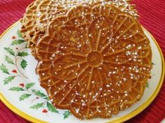 a plate topped with a piece of cake covered in caramel icing and sprinkles