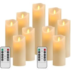 six lit candles with remote controls in front of each one on the left hand side