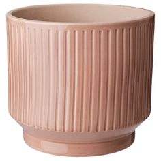 a large pink vase sitting on top of a white table