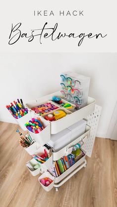 a white cart with lots of craft supplies in it and the words ike hack bastelwagen