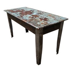 an old rusted metal table is shown against a white background