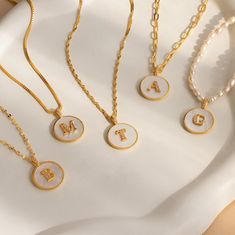 P E A R L ∙ C O I N ∙ I N I T I A L ∙ N E C K L A C E Our Pearl Coin Initial Necklace features a lustrous Mother of Pearl pendant with your initial encrusted in a delicate pavé setting. The perfect blend of elegance and shimmer, this necklace offers a timeless charm that beautifully complements any outfit. Personalize it and select your chain style to create a look that's uniquely yours ♡  * Material: High Quality Solid 925 Sterling Silver  * Finish: 18K Gold ∙ Sterling Silver ∙ Rose Gold  * Fea White Initial Pendant Necklace With Clavicle Chain, White Initial Pendant Clavicle Necklace, White Clavicle Chain Necklace With Initial Pendant, Classic White Jewelry With Initials, Trendy White Jewelry For Personalized Gift, Classic White Initial Necklace, Minimalist White Gold Plated Jewelry, Elegant White Charm Necklace For Everyday, White Necklace With Delicate Chain