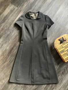 "1960's vintage A-line Marjorie Hamilton day dress in excellent condition. Gray wool, unlined with zipper closure and hook & eye at the back. This dress is very flattering on.  Has a fair amount of stretch. Princess seams and darts for form shaping. Measurements: Chest - 36\" Waist - 30\" Hem Opening - 50\" Length from high shoulder point - 39\" Across Shoulders - 14\" Sleeve length from shoulder seam - 6 1/2\"" Retro A-line Vintage Dress For Formal Occasions, Classic Fitted A-line Vintage Dress, Retro A-line Vintage Dress For Work, Classic Knee-length Vintage Dress For Work, Classic A-line Vintage Dress Lined, Vintage Fitted Dresses For Office, Fitted Vintage Dress For Office, Vintage Fitted Office Dress, Classic Fitted Vintage Dress For Workwear