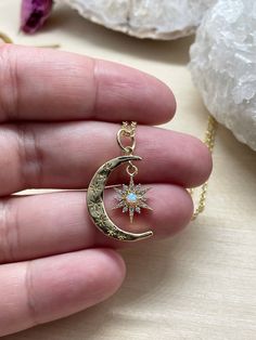 "This listing is for one gold crescent moon and star necklace. It has tiny cubic zirconia stones, and a man made opal inside it. This gorgeous statement piece hangs from a tarnish resistant gold chain. Your necklace will be stored in a hand stamped Kraft jewelry box, wrapped in bubble wrap, and mailed via USPS. If you spend over $35, domestic shipping is free! - \"All shadows of clouds the sun cannot hide like the moon cannot stop oceanic tide; but a hidden star can still be smiling at night's b Celestial Star Jewelry For Gifts, Celestial Star-shaped Jewelry Gift, Star-shaped Celestial Jewelry Gift, Celestial Jewelry With Star Charm For Gifts, Moon Phase Star Shaped Jewelry Gift, Celestial Style Star Charm Jewelry For Gifts, Celestial Star Jewelry For Jewelry Making, Celestial Crescent Jewelry With Birthstone, Celestial Moon Shaped Birthstone Jewelry