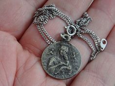 Religious antique French silver ( MARKED ) chain necklace with silver ( MARKED ) medal pendant charm of Holy Mary and Holy Christ. I bought the chain on a brocante ( fleamarket ) ( Lille ) in France. Measures of the chain : 18 inches ( 45 cm ) Measures of the medal ; 0,87 x 0,95 inches ( 2,03 x 2,43 cm ) If you don't have paypal you can pay by bank transfer. Registered shipping is possible. For other pictures or information do not hesitate to contact me. I deliver all over the world. Antique Silver Necklace For Commemoration, Vintage Oxidized Jewelry For Commemoration, Silver Jewelry With Vintage Charm For Commemoration, Silver Vintage Charm Jewelry For Commemoration, Vintage Miraculous Medal Round Pendant Jewelry, Nickel-free Antique Silver Cross Pendant Necklace, Antique Silver Nickel-free Cross Pendant Necklace, Vintage Miraculous Medal Round Pendant, Vintage Sterling Silver Miraculous Medal