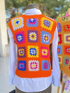 Multicolor Cotton Winter Vest, Casual Knitted Sweater For Festival, Multicolor Cotton Sweater Vest For Winter, Handmade Casual Fall Tops, Casual Multicolor Sweater Vest For Winter, Multicolor Hand Knitted Tops For Fall, Hand Knitted Multicolor Tops For Fall, Multicolor Patchwork Sweater One Size, Bohemian Winter Knitted Tops