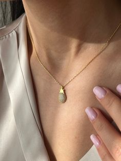 Tropical vibes with our Pineapple Necklace 🍍 Get this cute jewelry made with the high quality elements✨ You can go with 925K Sterling Silver with the options of Gold, Rose Gold or White Gold finish Beautiful jewelry for everyone 💙 Details * 925K Sterling Silver → 14K Gold, Rose Gold or White Gold plated * Chain length is approximately 18 inches (16+2 in extender) / 45 cm (40+5 cm extender) * Time is important! You will receive your package as soon as possible 🚚 * We care about the quality of Gold Plated Necklaces With Pave Setting For Gift, Gold Plated Pave Setting Necklace For Gift, Fine Jewelry Necklaces For Gifts, Sparkling, Sparkling Dainty Jewelry As Gift, Fine Jewelry Sparkling Necklaces For Gifts, Gold Necklaces With Pave Setting In Sterling Silver, Dainty Sparkling Yellow Gold Jewelry, Fine Jewelry Sparkling Necklace For Gift, Minimalist Sparkling Yellow Gold Jewelry