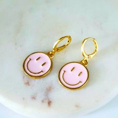 Pink Round Smiley Face Earrings. Huggies Earrings, Material Zinc Alloy And Enamel. 1.25 Length .4 Width Pink Fun Hoop Earrings As Gift, Fun Pink Hoop Earrings As Gift, Fun Pink Hoop Earrings For Gift, Pink Fun Dangle Jewelry, Fun Pink Dangle Jewelry, Cute Pink Hoop Earrings For Gift, Cute Pink Nickel-free Jewelry, Playful Pink Round Earrings, Pink Nickel-free Dainty Hoop Earrings