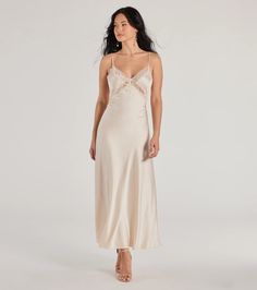 A delicate satin slip dress showcasing a sheer lace trim and a flowy silhouette perfect for styling with kitten heels or flats.Fit & FeaturesSilky satin woven fabric with woven lining, no stretchSleeveless V-neckline with sheer lace trim Adjustable spaghetti strapsHidden side zipper with hook-eye closureLong length hemFlowy silhouetteRuns true to size Feminine Silk Dress For Wedding Night, Silk Feminine Dress For Wedding Night, Sleeveless Modal Satin Slip Dress For Wedding, Feminine Dresses With Satin Trim, Elegant Sleeveless Satin Dress For Wedding Night, Elegant Satin Slip Dress With Subtle Sheen, Cream Silk Slip Dress With Spaghetti Straps, Elegant Satin Dress With Subtle Sheen, Feminine Sleeveless Bias Cut Satin Dress