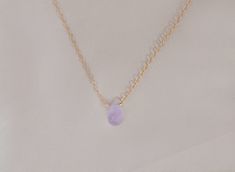 The loveliest gentle purple lavender Cape amethyst is featured on a necklace of sparkling chain, in your choice of sterling silver or 14kt gold filled, and pendant style or attached directly to the necklace chain. This delicately hued drop is ethereally beautiful and will not disappoint. The Cape amethyst necklace arrives presented in a black velveteen jewelry snapbox, ready for gifting. Necklace details: + 14mm cape amethyst faceted drop + High tensile strength 1.3mm cable chain + Spring clasp Delicate Adjustable Teardrop Jewelry, Minimalist 14k Gold Filled Teardrop Jewelry, Hypoallergenic Pendant Jewelry As A Gift For Her, Hypoallergenic Pendant Jewelry Gift For Her, Minimalist Gemstone Dangle Jewelry, Delicate Adjustable Pendant Jewelry, Elegant Round Pendant Charm Necklaces For Healing, Elegant Round Pendant Charm Necklace For Healing, Dainty Teardrop Yellow Gold Jewelry