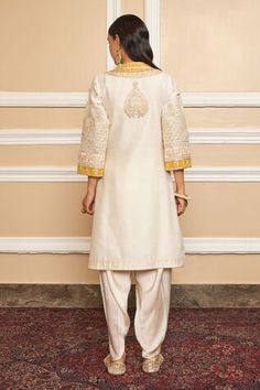 Daisy ivory short kurta with Kashmiri tilla, gota applique embroidered yoke in floral pattern. Paired with dhoti pant. - Aza Fashions Semi-stitched Jamawar Sets With Intricate Embroidery, Short Kurta With Dhoti Pants, Ankle-length Fitted Kurta With Cutdana, Semi-stitched Beige Kurta With Intricate Embroidery, Semi-stitched Ankle-length Kurta With Cutdana, Kurta Patterns, Short Kurta, Dhoti Pants, Embroidered Shorts