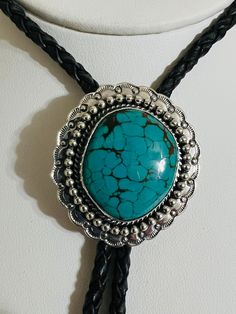 "*Handmade  * Material: genuine Turquoise, Sterling Silver , leather  *This awesome Bolo tie has a Southwestern design and turquoise stone * the Polo nicely , make wonderful gift * polo tie rope length is 38\" * Polo pendant size 2\"x 1 5/8\"" Southwestern Bolo Tie With Sliding Knot, Artisan Turquoise Adjustable Lariat Necklace, Artisan Turquoise Lariat Necklace Adjustable, Bohemian Lariat Bolo Ties For Festivals, Artisan Adjustable Turquoise Lariat Necklace, Southwestern Lariat Bolo Tie For Rodeo, Handmade Lariat Bolo Tie For Rodeo, Artisan Turquoise Bolo Ties With Concho, Western Lariat Bolo Tie With Adjustable Length