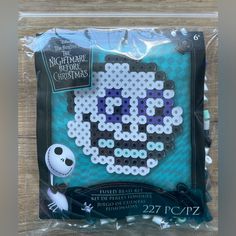 the nightmare christmas cross stitch pattern is in plastic bag with cellophane wrapper