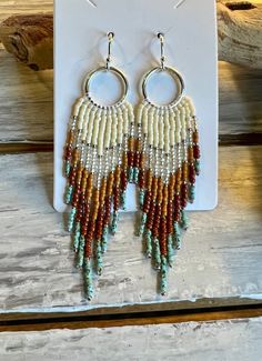 Striking hand-beaded earrings in the long fringe style.  Two pair are inspired by beautiful cities in the Southwest. Two pair are just simple fringe styles. Nickel and lead safe. Artisan Fringe Tassel Dangle Earrings, Artisan Tassel Dangle Earrings With Fringe, Artisan Dangle Tassel Earrings With Fringe, Bohemian Long Drop Fringe Earrings, Bohemian Fringe Dangle Chandelier Earrings, Bohemian Long Drop Tassel Earrings With Colorful Beads, Fringe Dangle Chandelier Earrings For Festival, Bohemian Beaded Dangle Earrings With Tassels, Bohemian Tassel Earrings With Beaded Fringe