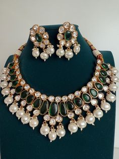 Premium Polki Kundan Stone Double Layer Necklace with Earrings Arrives in a gift box! Plating: anti-tarnish Moissanite polki Stone: It has an Excellent Lustre of Moissanite Polkis which are the best substitute for Real Polkis. Green Kundan Necklace For Formal Occasions, Formal Green Kundan Necklace, Green Temple Jewelry Set For Anniversary, Green Jewel Bridal Necklace For Anniversary, Green Jeweled Bridal Necklace For Anniversary, Anniversary Green Jeweled Bridal Necklace, Kundan Emerald Necklace As Gift, Kundan Emerald Gemstone Necklace As A Gift, Gift Kundan Emerald Necklace