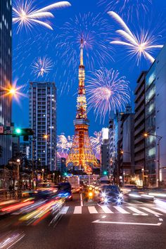 the eiffel tower is lit up with fireworks