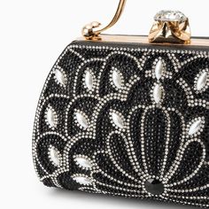 Introducing the Augustine Pearls Handbag - an enchanting masterpiece crafted to elevate your evening attire to unprecedented levels of sophistication. This clutch exudes magnificence in every detail, adorned with shimmering rhinestones and delicate pearl accents. Remarkably lightweight, it guarantees seamless carrying all through the night without compromising on style. Now available in blue, black, silver, and red. Glamorous Handheld Evening Bag With Rhinestones, Black Embellished Evening Bag, Chic Rhinestone Event Bag, Chic Rhinestone Event Bags, Elegant Wedding Shoulder Bag With Pearl Embroidery, Evening Rectangular Shoulder Bag With Pearl Handle, Embellished Handheld Clutch For Evening, Silver Evening Bag With Pearl Embroidery For Party, Evening Shoulder Bag With Pearl Handle, Rectangular Shape