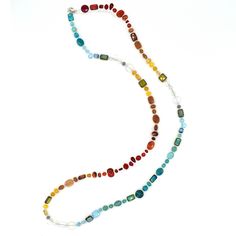 This necklace is made from a gorgeous mix of natural gemstones and Czech glass. Each necklaces is one-of-a-kind and contains carnelian, opalite, red aventurine, ruby jade, turquoise, teal jade and goldstone. Features a sterling silver lobster clasp and chain at the back. This versatile piece can be worn three ways: long, doubled, or as a bracelet. Adjusts from 40 inches to 44 inches long. Chalcedony Gemstone Necklace With Round Beads, Bohemian Glass Jewelry With Single Strand, Bohemian Single Strand Glass Jewelry, Bohemian Glass Single Strand Jewelry, Multicolor Single Strand Crystal Necklace For Healing, Multicolor Single Strand Gemstones As A Gift, Multicolor Single Strand Jewelry For Healing, Chalcedony Necklaces With Natural Stones, Chalcedony Natural Stone Round Necklaces