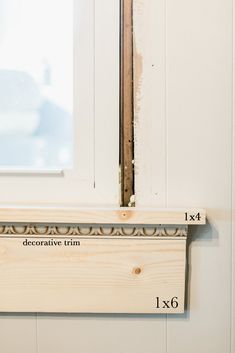 an unfinished window sill with measurements for the top and bottom trims on it