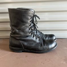 "Bates Floataways combat boot in a black leather with lace up on front. Thick rubber soles.  Condition is good. Used condition with scuffs. No breaks or tears. Lots of wear left on heels and soles. Size 13 on inside. at least that's what it looks like. It is faint but I just listed a size 12 boot and it is slightly bigger. Please look at measures. Length outside from wall: 12 7/8\" Width outside bottom: 4 1/2\" Total height in back: 10 3/8\" Heel: 5/8\" Boot height: 9\"" Leather Combat Work Boots With Round Toe, Combat Leather Work Boots With Round Toe, Combat Boots With Vibram Sole In Leather, Combat Leather Boots With Vibram Sole, Combat Work Boots With Vibram Sole, Leather Combat Boots With Round Toe, Combat Style Work Boots With Vibram Sole, Black Combat Boots For Fall, Combat High-top Leather Lace-up Boots