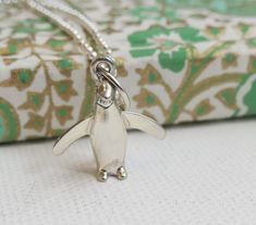 This listing is for **ONE Sterling Silver Penguin charm Necklace**  ✦Length of chain is 18 inches.  ✦length of pendant is 23mm. ✦Metal: sterling silver (925) This will be sent from Norway I have  real passion for beautiful embellishments, wearable design and gorgeous handmade jewellery. I am inspired by exotic cultures, exquisite stones and the essential colours of nature.  I showcase a unique fusion of colored gemstone jewellery,  modern yet timeless design and masterful craft techniques to create unique gemstone jewellery for everyday modern women. Each  piece is handmade using the finest gemstones, sterling silver and 18 carat gold plating, so you can have the look and feel of fine jewellery for any occasion. Please be aware that each item is made by human beings and not by machines. Th Handmade Gifts For Women, Penguin Necklace, Craft Techniques, Gemstone Jewellery, Modern Women, Gifts Birthday, Unique Gemstones, Friendship Gifts, Handmade Jewellery