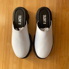 Never Worn, New In Box Clogs (Fyi-I Will Not Be Shipping Them In The Original Box). They Have A Thick, Rubber Sole And Are Roomy. They Are A Size 38, Fit Is 7-7/2. I Normally Wear A 7 And They Fit Well With A Tad Of Extra Room On Foot Bed. From A Pet/Smoke Free Home. Casual Synthetic Clogs With Lug Sole, Trendy Clogs With Lug Sole And Round Toe, Trendy Slip-on Clogs With Lug Sole, White Platform Clogs With Round Toe, White Platform Clogs With Closed Toe, White Platform Slip-on Clogs, White Closed Toe Platform Clogs, Chunky Platform Round Toe Synthetic Clogs, Synthetic Chunky Platform Clogs With Round Toe