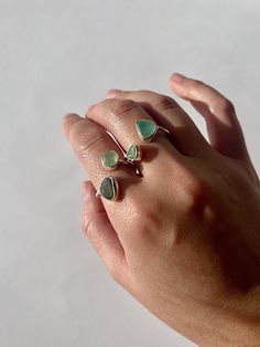 The seaglass is handpicked from southwest coastlines England. The seaglass for your ring is roughly 5mm-8mm, The band of your sea glass ring  is 1.5mm wide, making it very light and comfortable to wear daily.  The ring size is adjustable, the sizing is very flexible. Small one can fit from size H - O, and the bigger one can fit O to Z.  All the seaglass colour and size are randomly selected, if you require a specific colour please let me know, I will do my best to accommodate with what I have in Adjustable Sea Glass Ring Jewelry, Handmade Sea Glass Ring Jewelry, Handmade Adjustable Sea Glass Rings, Silversmithing Jewelry, Sea Glass Ring, Ocean Jewelry, Glass Ring, How To Make Rings, Jewellery Handmade