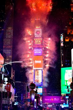 fireworks are lit up the night sky above times square in new york city, ny