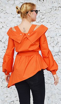 Orange cotton top with long sleeves.Bright wonderful orange tunic. Material 95%cotton, 5% elastane The model in the picture is size S. Can be made in ALL SIZES. If you have any other specific requirements, do not hesitate to contact me! I DO NOT CHARGE EXTRA MONEY for custom made items. All you need to do is send me your measurements. Below, you will find a table with size references. How to get an accurate measurement: * Chest: the circumference, measure the fullest part of your chest ( bra inc Chic Orange Cotton Blouse, Chic Orange Long Sleeve Blouse, Orange Long Sleeve Cotton Blouse, Orange Tops For Workwear In Fall, Orange Workwear Tops For Fall, Fitted Orange Tops For Work, Orange Tops For Fall Workwear, Orange Fall Workwear Tops, Orange Cotton Blouse For Work