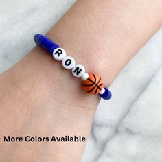 Sports Jewelry, Persaonlize sports bracelet lightweight and comfortable. Select your own color and personalize it with your team name, your name, or your jersey #.    The perfect giveaway for the team, grandkids, kids, party favors, birthdays and so much more. SEE SIMILAR ITEMS HERE: https://etsy.me/3ZxTGC0  💖ITEM DETAILS: Elastic band, Polymer Clay beads 💖BRACELET SIZING: Please refer to our last picture slide to see how to measure your beautiful bracelets (Please note: Drop-down menu size chart is estimated. Specific measurements will ensure a better fit for your custom order) 💖ALL ORDERS ARE FINAL.  These are custom jewelry made to order. Please be sure to DOUBLE CHECK all your spelling and color selections prior to checkout If you have any issues with your order, please feel free to Team-colored Sports Bracelets With Letter Beads, Team-colored Bracelets With Letter Beads For Sports, Team-colored Letter Beads Bracelets For Sports, Sporty Beaded Bracelets In Team Colors For Sports Events, Sporty Team-colored Beaded Bracelets For Sports Events, Sporty Beaded Bracelets With Letter Beads For Team Events, Sporty Beaded Bracelets With Letter Beads For Sports Events, Team-colored Bracelets For Sports, Blue Adjustable Beaded Bracelets For Team Spirit