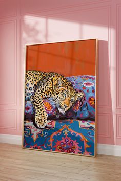 a painting of a leopard laying on top of a blue and orange rug in a pink room