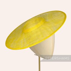 *This is not a fitted hat! You will need to attach a headband, comb or elastic to secure it to your head* This yellow cartwheel hat base is a classic shape that has sprung into popularity in the past year. Made from 2 layers of stiffened sinamay, these cartwheels are ready to trim and are fitted with a petersham ribbon on the inside crown edge. Simply add a comb or headband to secure to the head. Hat base measures: Width: 35.5cm (14 inches) Crown Width: 13.5cm (5.3 inches) Crown Height: Approxim Adjustable Flat Brim Fascinator For Beach, Adjustable Curved Brim Boater Hat For Church, Adjustable Brimmed Beach Fascinator, Adjustable Short Brim Fascinator For Beach, Adjustable Flat Brim Costume Hats For Church, Adjustable Flat Brim Top Hat For Church, Adjustable Straw Hat With Structured Crown For Kentucky Derby, Adjustable Structured Crown Straw Hat For Kentucky Derby, Adjustable Straw Hat With Structured Crown For Spring