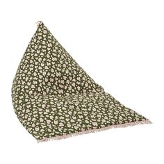 a green and white pillow with pink flowers on it