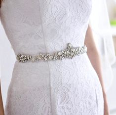 Add a touch of classic elegance to your bridal gown with this sparkling beaded belt! Adorned with an array of glowing Swarovski opals and crystals on a silver base, it will give your dress an extra touch of glam to finish off your perfect look on your wedding day. The crystal appliqué measures approx. 14" (approx. 35.5cm) long by 2" (approx. 5cm) at the widest point. It can be ordered attached to your choice of white organza ribbon, white or ivory double-faced satin ribbon, 0.75" (approx. 2cm) w Bridal Sash Belt, Ribbon White, Bridal Sash, Beaded Belt, Sash Belts, Bridal Belt, Organza Ribbon, White Satin, Classic Elegance