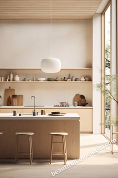 the kitchen is clean and ready for us to use in its new home, which also features an island with stools