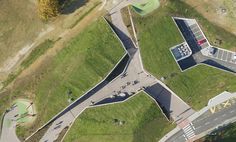 an aerial view of a skate park with ramps