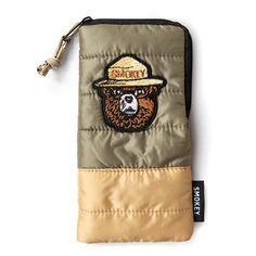 Featuring a Smokey Bear patch and a nostalgic color scheme  the CAMP Eyewear Smokey Bear Sleeping Bag accessory pouch is the perfect size to stash your sunglasses  phone  cash or snacks. Bear Sleeping Bags, Hiking Sunglasses, Bear Sleeping, Sunglasses Sport, Smokey Bear, Casual Sunglasses, Forest Service, Accessory Pouch, Camping And Hiking