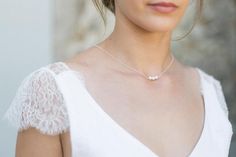 This pretty necklace with back jewel will be perfect to enhance the backless neckline of your wedding dress. The delicacy of its pearls will charm you and bring a very elegant touch to your outfit.It consists of a silver chain, three pearl beads on the front and three dinging on the back.This necklace has no clasp, it simply slips by the head, so you will have to pay attention to the larger hairstyles.Available in silver, gold filled (high quality gold plated) and gold filled rose (high quality Elegant Pearl White Backdrop Necklace With Pearl Drop, Elegant Wedding Clavicle Pearl Necklace, Elegant Wedding Pearl Necklace With Clavicle Chain, Elegant Pearl Backdrop Necklace With Pearl Drop, Elegant Silver Backdrop Necklace With Adjustable Chain, Elegant Pearl Charm Necklace For Wedding, Elegant Wedding Necklace With Pearl Charm, Elegant Pearl Necklace With Delicate Chain For Party, Elegant Adjustable Necklace For Wedding