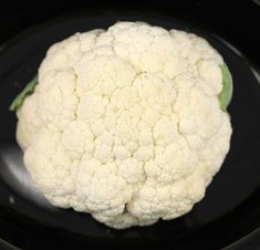 a cauliflower is sitting in the crock pot