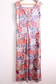 "Pretty floral print maxi dress from the 70s. It has thick straps and easy fit with a zipper up the back to close. Great condition. 100% Polyester Size 12 Measures: 7.5\" wide sleeve hole 56\" long 19\" wide under arms 17\" wide lying flat at waist 20\" hip 32\" wide at bottom hem D-2" Spring Retro Print Maxi Dress, Spring Maxi Dress With Retro Print, Spring Floral Print Full-length Maxi Dress, Multicolor Retro Maxi Dress With Floral Print, Retro Multicolor Floral Print Maxi Dress, 1970s Floral Print Maxi Dress, Vintage Spring Maxi Dress With Vintage Print, Spring Vintage Maxi Dress With Vintage Print, Retro Floral Print Maxi Dress